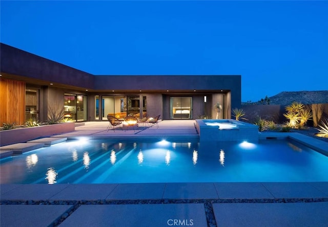 view of pool with a patio and an in ground hot tub