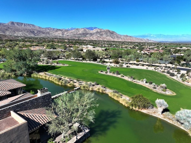 drone / aerial view with a water and mountain view