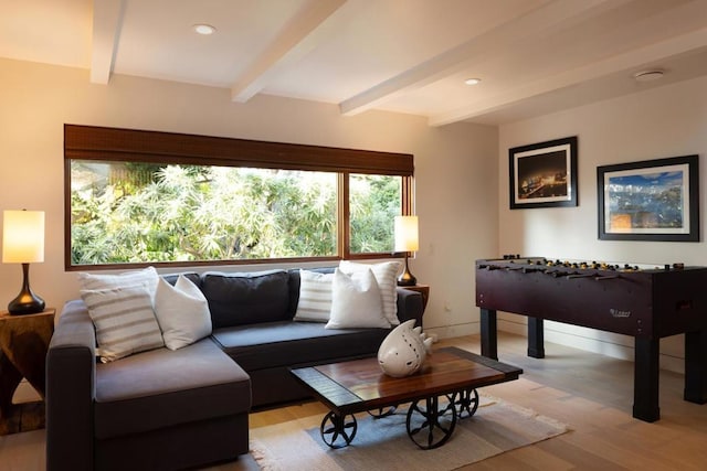 living room with beam ceiling and light hardwood / wood-style floors