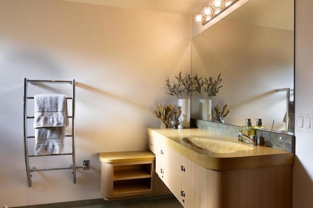 bathroom with tile patterned flooring and vanity