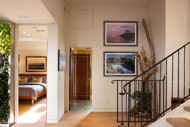 hall with light hardwood / wood-style floors