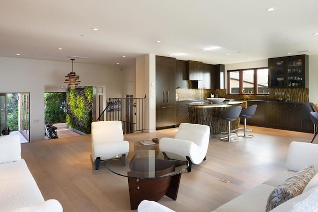 living room with light hardwood / wood-style flooring