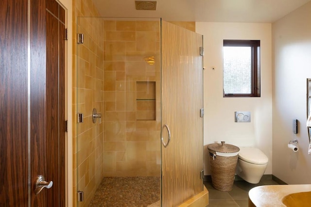 bathroom with an enclosed shower, vanity, tile patterned floors, and toilet