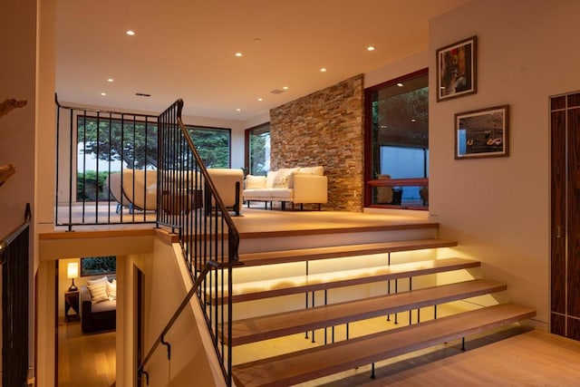 stairs with hardwood / wood-style floors