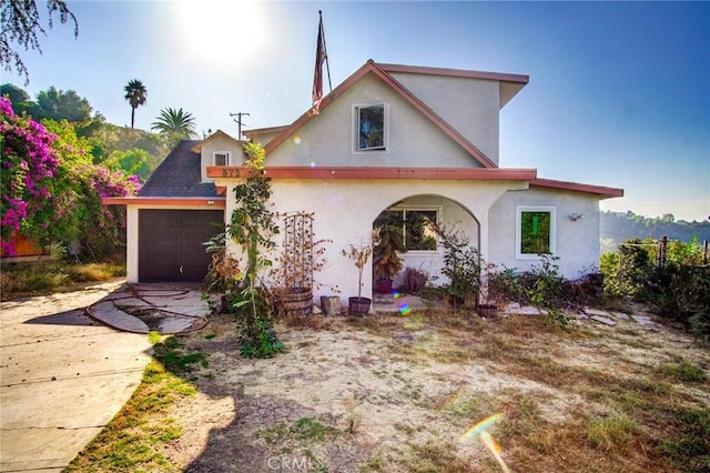 572 Church Hill Rd, La Habra Heights, CA 90631 - view of front of home with stucco siding, concrete driveway, and an attached garage
