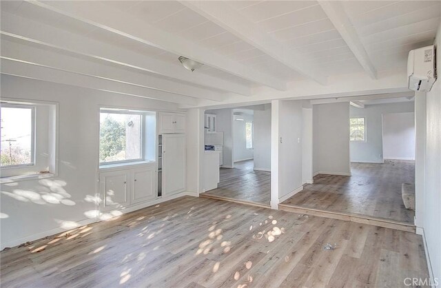 572 Church Hill Rd, La Habra Heights, CA 90631 - spare room with a wall unit AC, light wood-style flooring, and beam ceiling