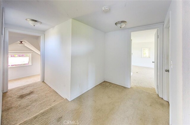 572 Church Hill Rd, La Habra Heights, CA 90631 - empty room featuring light carpet, a smoke detector, and healthy amount of natural light