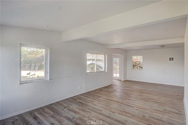 572 Church Hill Rd, La Habra Heights, CA 90631 - empty room with healthy amount of natural light, beamed ceiling, and wood finished floors