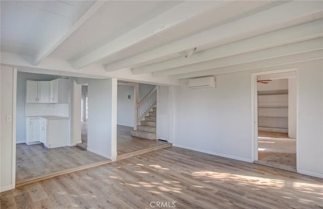 572 Church Hill Rd, La Habra Heights, CA 90631 - basement with light wood-type flooring, stairs, and a wall unit AC