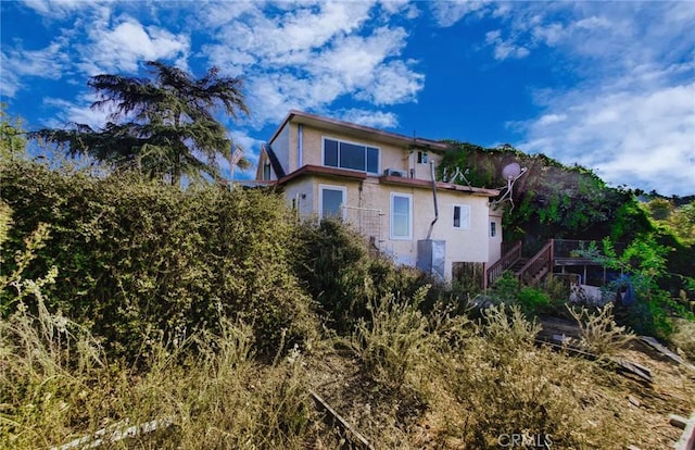 572 Church Hill Rd, La Habra Heights, CA 90631 - back of property with stucco siding and stairway