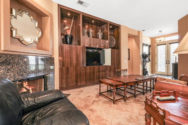 tiled living room with a premium fireplace