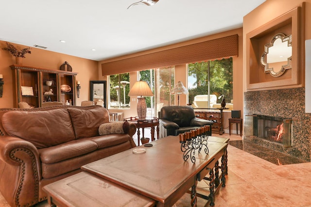 living room featuring a fireplace and tile patterned floors