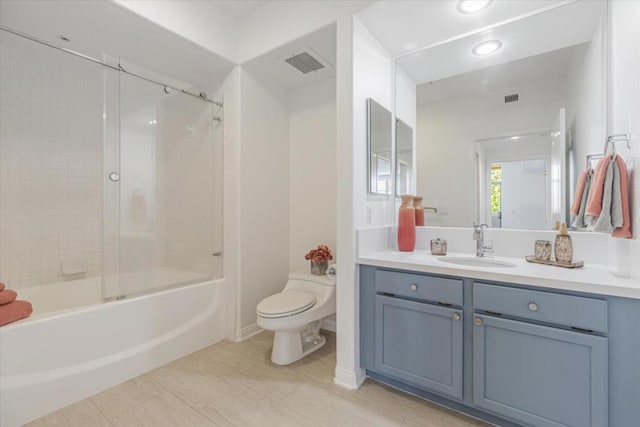 full bathroom with enclosed tub / shower combo, toilet, vanity, and tile patterned flooring