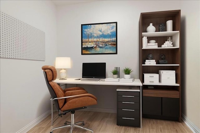 office area with light hardwood / wood-style flooring