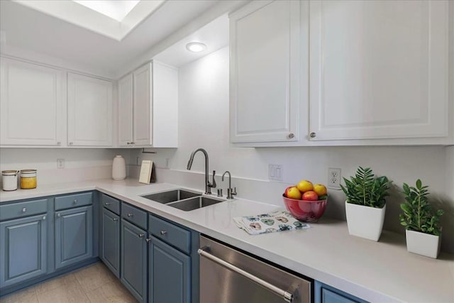 kitchen featuring sink, white cabinetry, blue cabinets, and stainless steel dishwasher