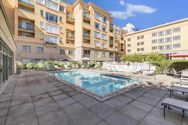 view of swimming pool featuring a patio