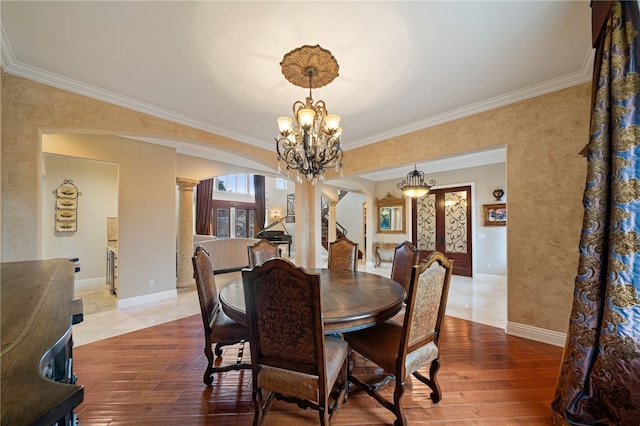 18378 Avenida Bosque, Murrieta, CA 92562 - dining space with crown molding, baseboards, ornate columns, and a chandelier