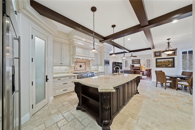 kitchen featuring hanging light fixtures, sink, beam ceiling, tasteful backsplash, and appliances with stainless steel finishes