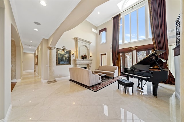 interior space with crown molding and ornate columns