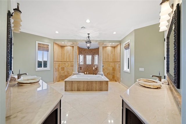 bathroom featuring ornamental molding, tiled tub, and vanity