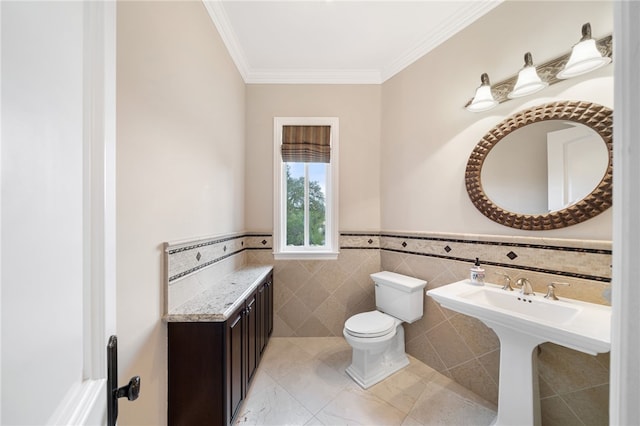 bathroom featuring tile walls, ornamental molding, and toilet