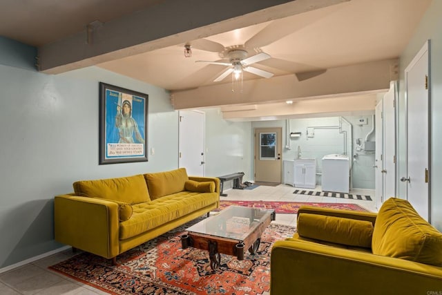 living room featuring ceiling fan, light tile patterned floors, beam ceiling, and washer / clothes dryer