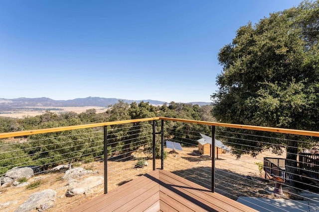 wooden terrace featuring a mountain view