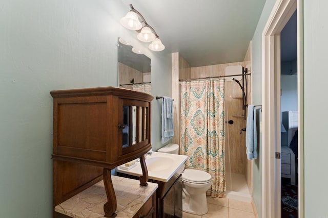 bathroom with tile patterned floors, toilet, vanity, and a shower with shower curtain