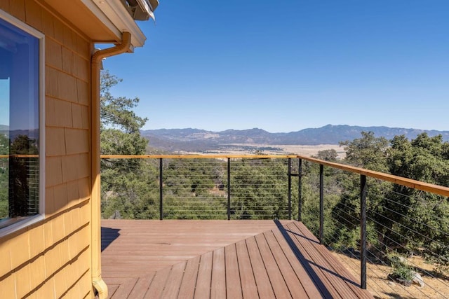 wooden deck with a mountain view