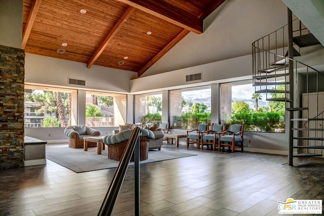 interior space with beamed ceiling, hardwood / wood-style floors, high vaulted ceiling, and wood ceiling