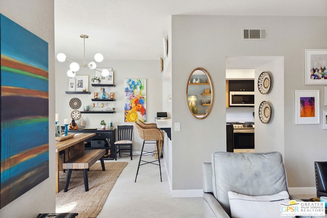 dining space featuring carpet flooring and an inviting chandelier