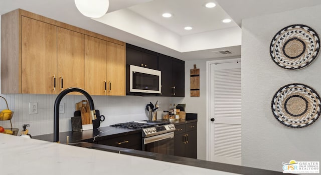 kitchen featuring appliances with stainless steel finishes and sink