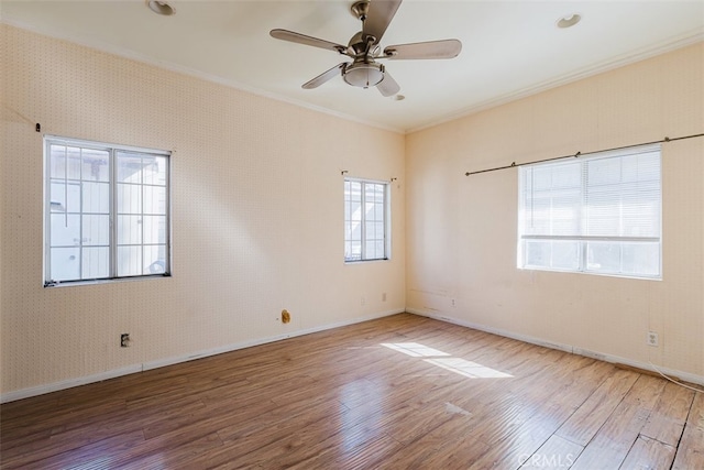 unfurnished room featuring ceiling fan, hardwood / wood-style flooring, and crown molding