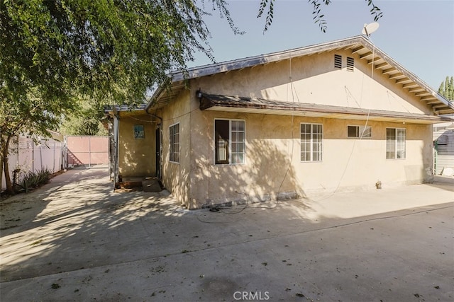 back of property featuring a patio area