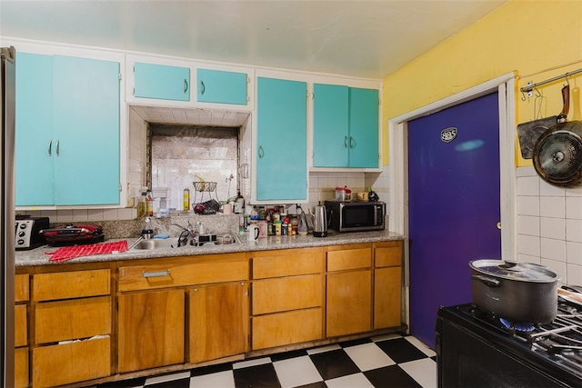 kitchen with tasteful backsplash and sink