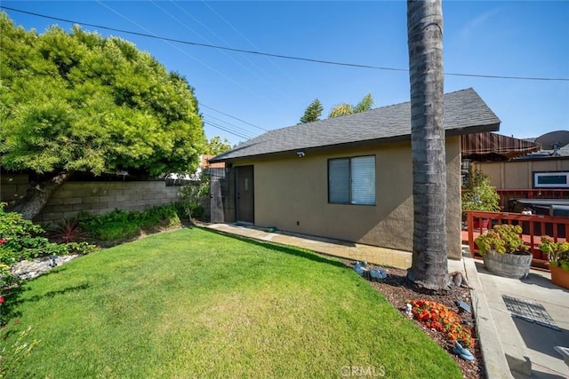 rear view of house with a lawn