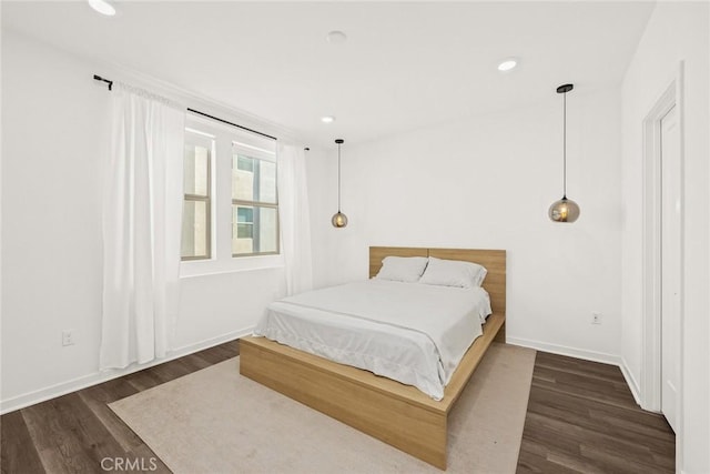 bedroom featuring dark hardwood / wood-style flooring