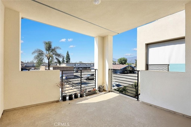 view of patio featuring a balcony