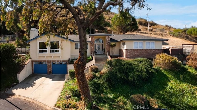 view of front of property with a garage