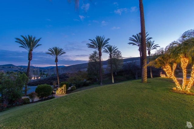 yard at dusk with a mountain view