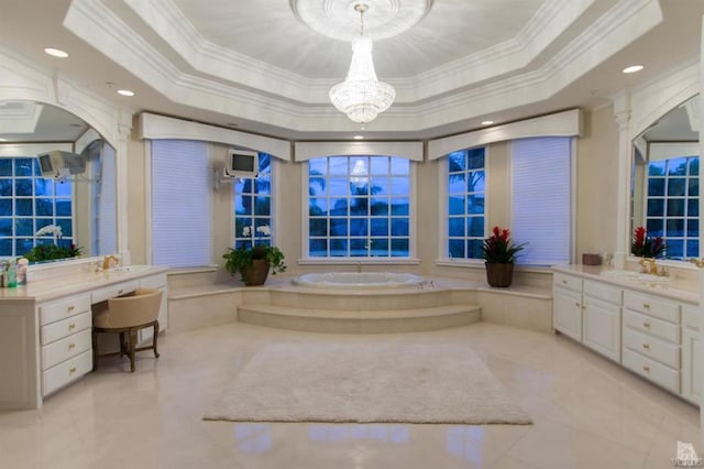 bathroom featuring ornamental molding, a tub to relax in, and a tray ceiling