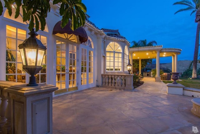 view of patio featuring a mountain view and french doors