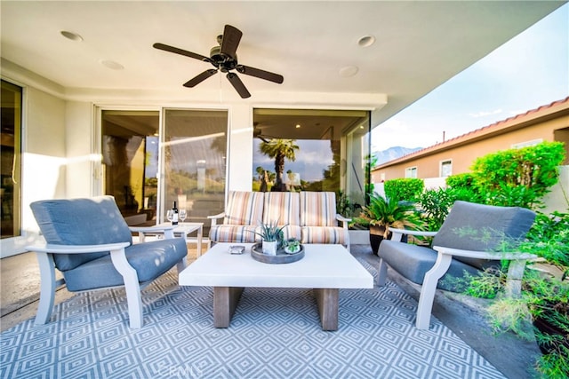 view of patio featuring an outdoor living space and ceiling fan