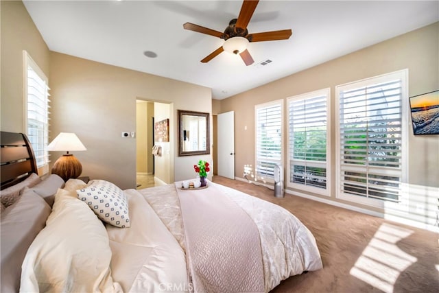 carpeted bedroom with ceiling fan