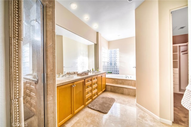 bathroom with shower with separate bathtub and vanity