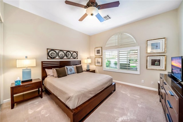 bedroom with light carpet and ceiling fan