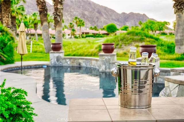 view of pool with a mountain view