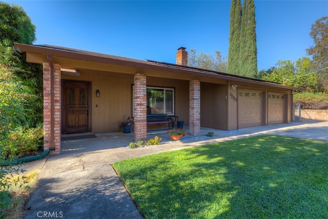 single story home with a garage, a porch, and a front lawn