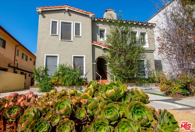 mediterranean / spanish-style house featuring a garage