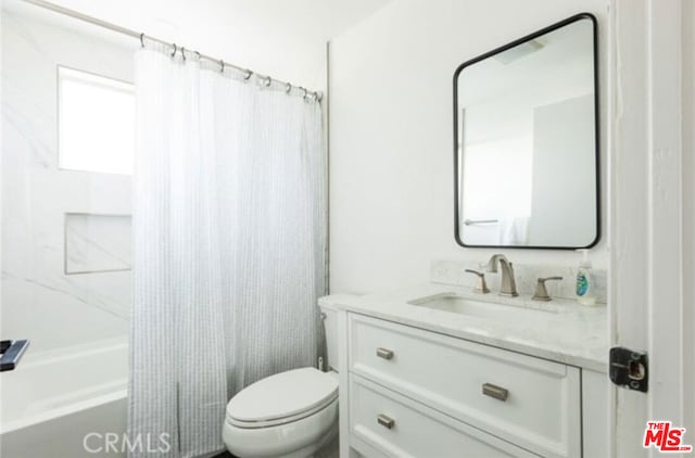 full bathroom with vanity, toilet, and shower / bathtub combination with curtain